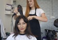 Woman hairdresser in beauty salon cut hair and hair design Royalty Free Stock Photo