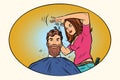 Woman hairdresser cuts the bearded hipster