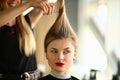 Woman hairdresser cuts long hair to client in beauty salon Royalty Free Stock Photo
