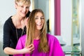 Woman at the hairdresser getting advise Royalty Free Stock Photo