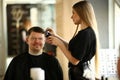 Woman Hairdresser Making Razor Haircut for Man Royalty Free Stock Photo