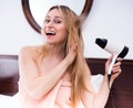 Woman hairdryer in room Royalty Free Stock Photo