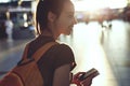 Woman in the hall of the airport terminal with a passport and boarding pass Royalty Free Stock Photo