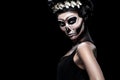 Woman in Halloween costume of Frida Kahlo with copy space. Skeleton or skull makeup. Royalty Free Stock Photo