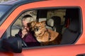 Woman ham amateur radio operator with dog in car Royalty Free Stock Photo