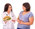 Woman with hamburger and doctor Royalty Free Stock Photo