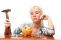 Woman with hammer and piggy bank. Royalty Free Stock Photo