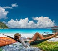 Woman in hammock on beach