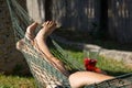 Woman on hammock chilling out holding cocktail glass Royalty Free Stock Photo