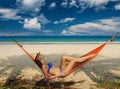 Woman in hammock on beach