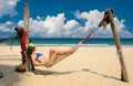 Woman in hammock on beach