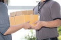 Woman hand accepting a delivery of boxes from deliveryman Royalty Free Stock Photo