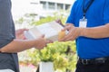 Woman hand accepting a delivery of shockproof boxes from deliver Royalty Free Stock Photo