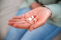 Woman hand with antidepressant pills on her palm Royalty Free Stock Photo