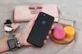 Woman hand Apple Watch holding iPhone 7 Jet Black Onyx