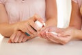 Woman hand applying hand sanitizer