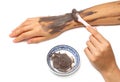 Woman hand applying spa cosmetic clay cream