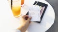 Woman hand with bill holder in a restaurant of soft drink for check and cash money Royalty Free Stock Photo