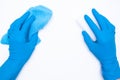 Woman hand in blue rubber gloves holds rag and sponge on white background. cleaning and regular clean up concept. Top view. flat