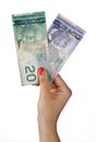 Woman hand with canadian dollar bills