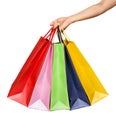 A woman hand carrying a bunch of shopping bags isolated on white Royalty Free Stock Photo