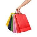 A woman hand carrying a bunch of shopping bags isolated on white Royalty Free Stock Photo