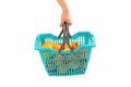 Woman hand carrying a full shopping basket. Royalty Free Stock Photo