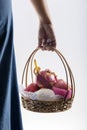 Woman hand carrying a shopping basket full of fruits. Royalty Free Stock Photo