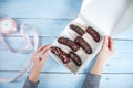 Woman hand chocolate bananas on box