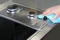 Woman hand cleaning kitchen cooking top