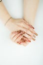 Woman hand close-up with beautiful manicure on white background