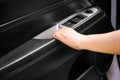 Woman hand closing car interior door