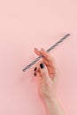 Woman hand with cocktail drinking straw Royalty Free Stock Photo