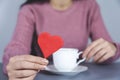 Woman hand coffee and red heart Royalty Free Stock Photo