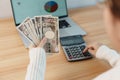 Woman hand counting Japanese Yen banknote with calculator. Thousand Yen money. Japan cash, Tax, Recession Economy, Inflation, Royalty Free Stock Photo