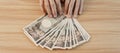 Woman hand counting Japanese Yen banknote over table background. Thousand Yen money. Japan cash, Tax, Recession Economy, Inflation