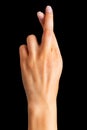 Woman hand with crossed fingers, gesture of good luck symbol