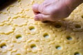 Woman hand cutting the dough of canestrelli biscuits Royalty Free Stock Photo