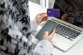 Woman hand entering password code on mobile phone paying bill with credit card on desk at home office, internet, digital marketing Royalty Free Stock Photo