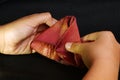 Woman hand folding banana blossom.