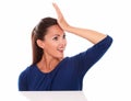 Woman with hand on forehead looking surprised Royalty Free Stock Photo