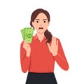 Woman with hand gesturing no or stop while holding money. No gamble or wrong investment Royalty Free Stock Photo