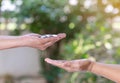 Woman hand give money coin to hand