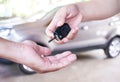 woman hand gives the car key Royalty Free Stock Photo