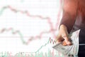 Woman hand giving dollar cash on stock trading graph background