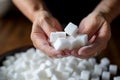 hand hold bowl sugar cubes