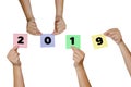 Woman hand hold Paper notes with label Happy New Year 2019 Clip Royalty Free Stock Photo