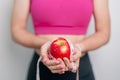 woman hand hold red Apple, happy female fitness choose fruit is Healthy food. Dieting control, Weight loss, Obesity, eating Royalty Free Stock Photo