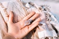 Woman hand holdin beautiful sea shell outdoors