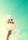 Woman hand holding balloon. I Love You symbol Royalty Free Stock Photo